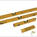 A stock photo showing what comes in the Stabila spirit level pack, with three spirit levels of varying sizes, a pack of carpenters pencils and a key ring level